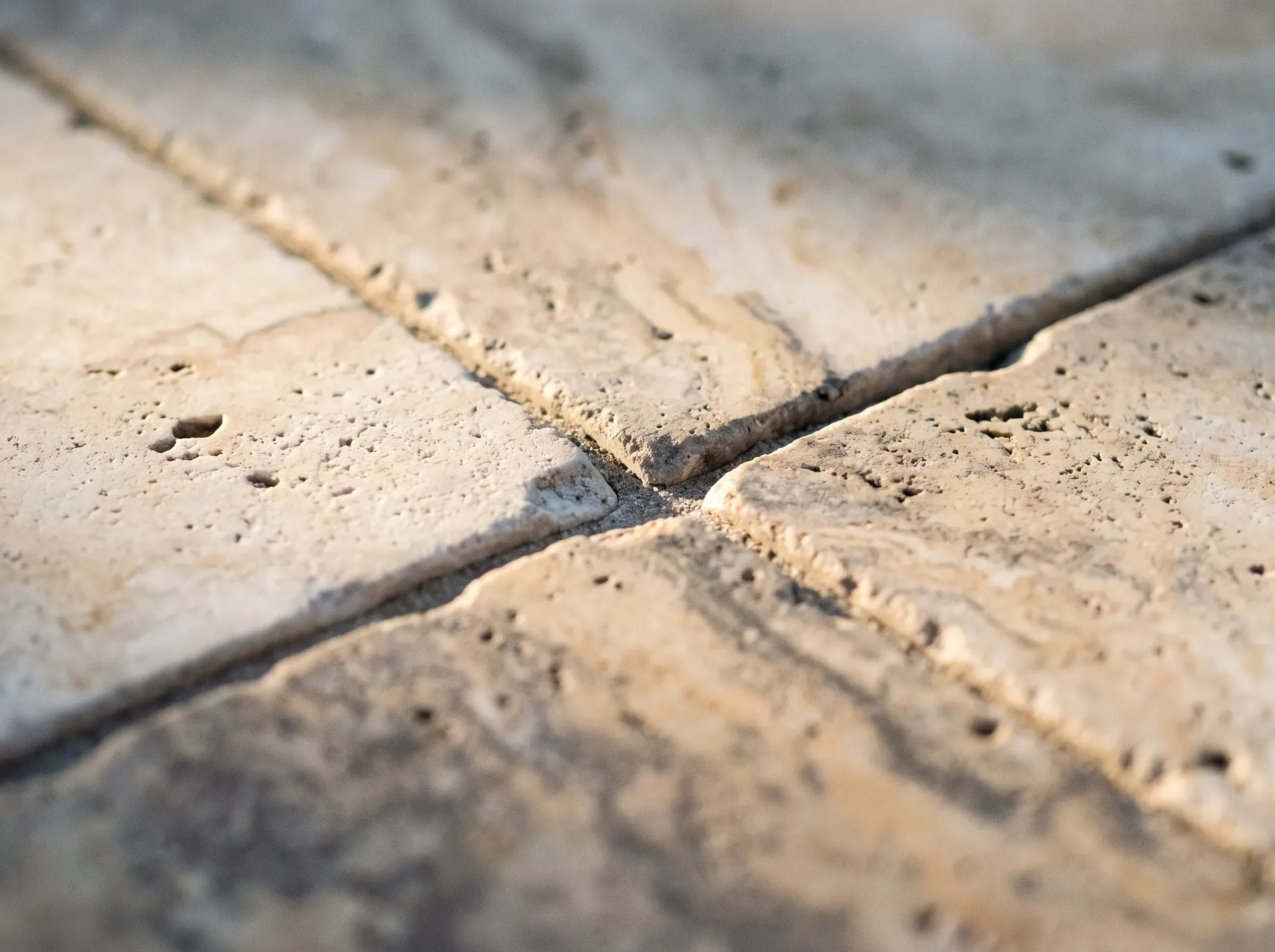 Natural pitting and colour variation in travertine